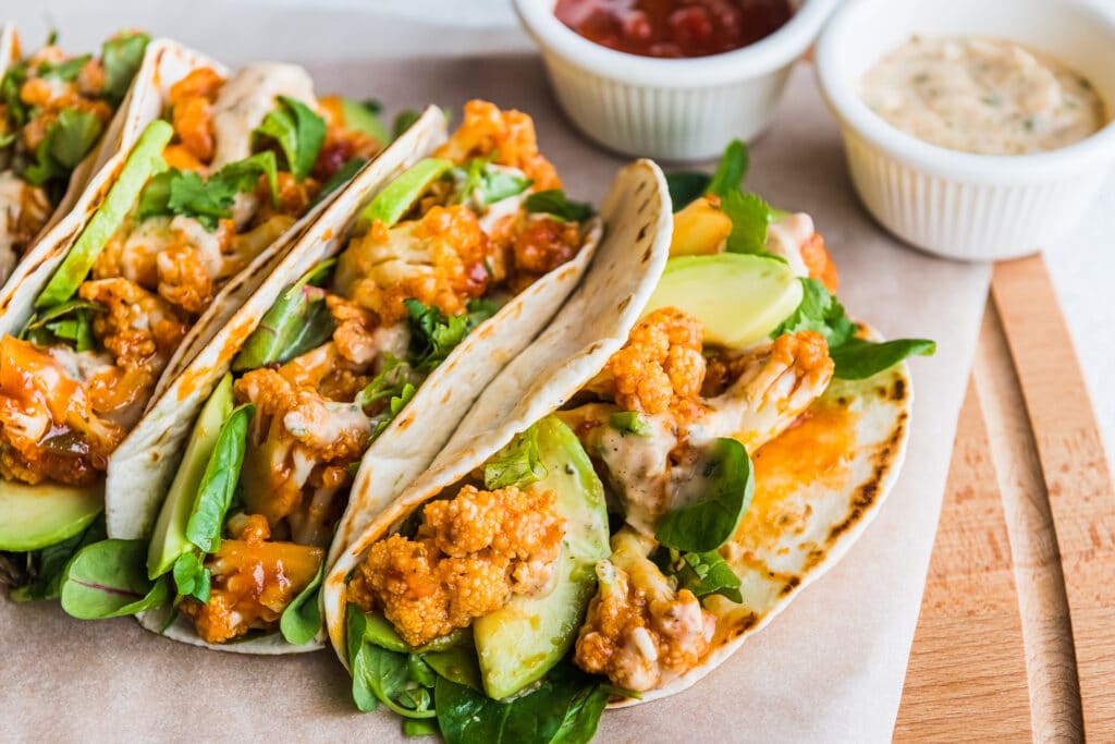 Spicy Cauliflower Tacos with Cilantro Lime Crema